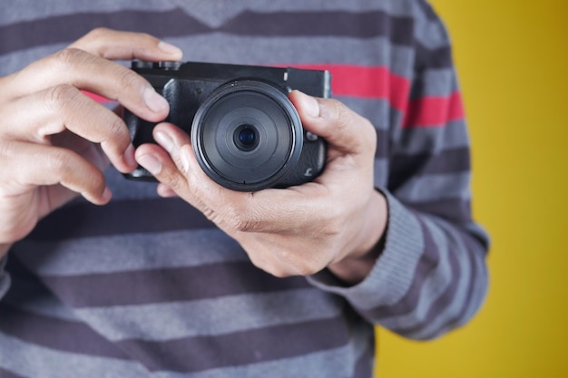 A men is taking pictures on a camera