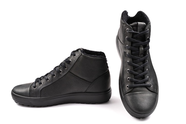 Men's black leather shoes on a white background.