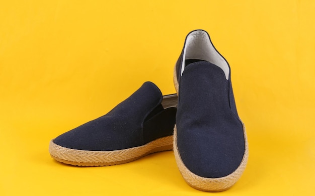 Men's espadrilles on a yellow background Men's summer shoes