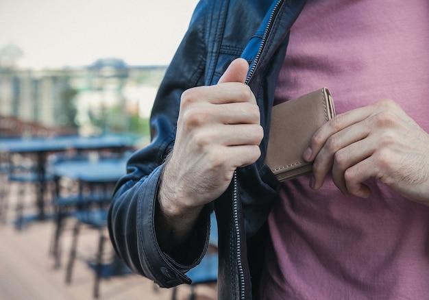 Men's hand wallet in the pocket