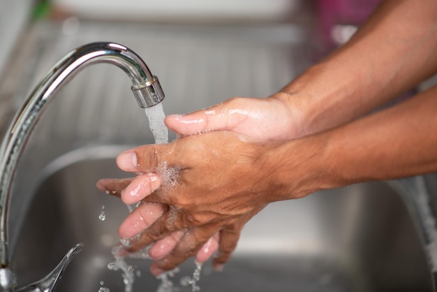 Men's hands are showing ways to wash their hands with a cleaning gel to prevent infectious diseases and prevent the virus