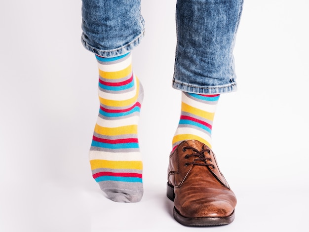 Men's legs, trendy shoes and bright socks. Close-up. Style, beauty and elegance concept