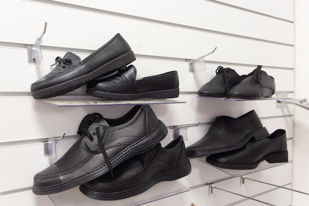 Men shoes for the deceased in a funeral goods store