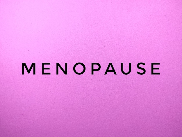 MENOPAUSE word on pink background