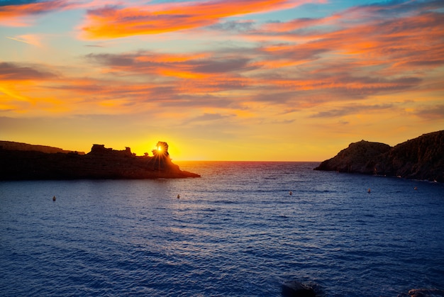 Menorca sunset in Cala Morell at Ses torretes beach