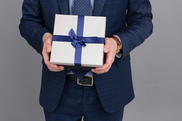 Mens day present Successful man share gift box Businessman prepare for romance date Business reward Business man with corporate gift box Corporate reward present Cropped view