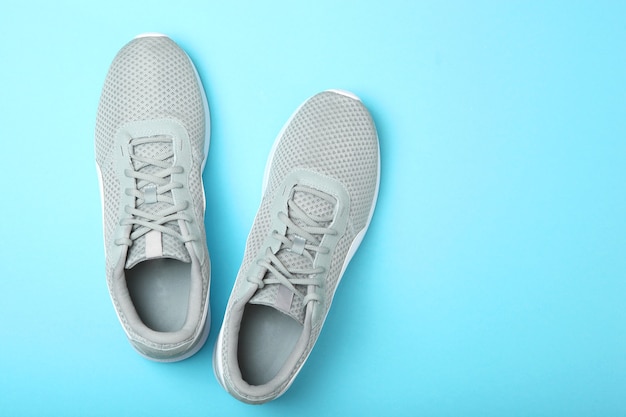 Mens sneakers on a colored background mens footwear minimalism