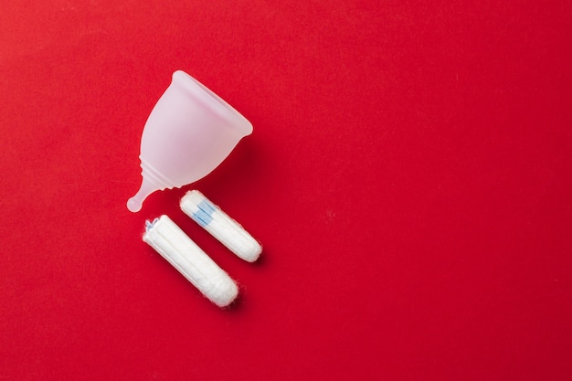 Menstrual cup and medical tampon close up