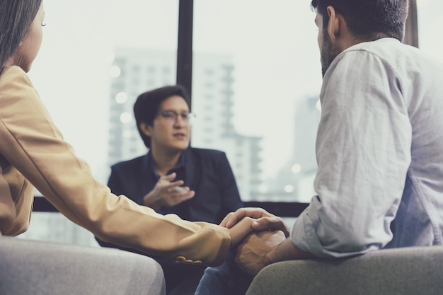 Mental health concept, couple problematic young people talking with a guidance counselor.