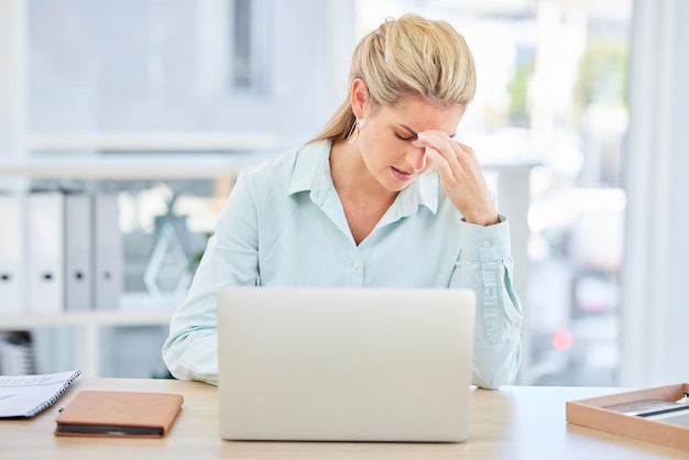 Mental health laptop and woman with burnout headache from feedback review of financial portfolio investment research or trading report Problem economy and trader stress over stock market crash