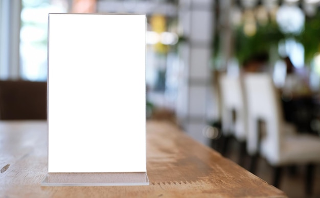 Menu frame standing on wood table in Bar restaurant cafe space for text marketing promotion