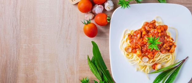 Menu pasta spaghetti with meatballs and tomato on the tableTop view