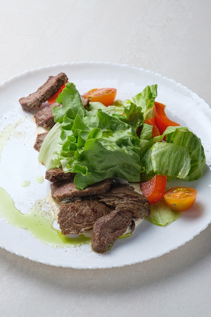 menu for the restaurant salad with beef lettuce and cherry tomatoes and spice dressing