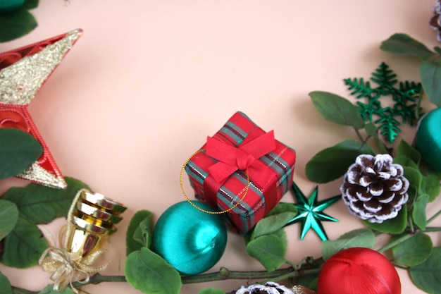 Merry Christmas and decorations with light yellow background.