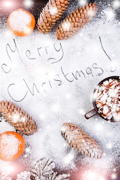 Merry Christmas Handmade Text on Snow. Christmas Food Sweet Marshmallow with Chocolate in Brown Cup