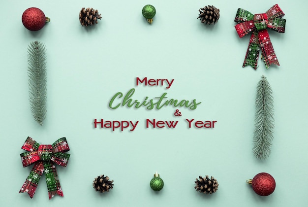 Merry Christmas and Happy Holidays greeting card Christmas ornaments and gifts on light background