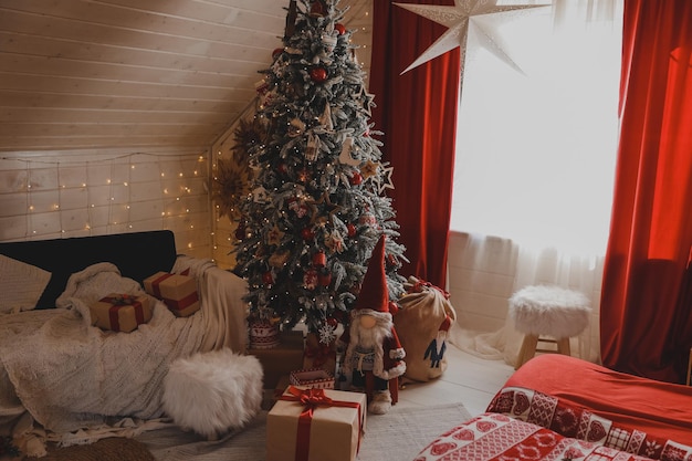 Merry Christmas and happy holidays. Stylish living room interior with decorated Christmas tree and comfortable sofa. New Year.