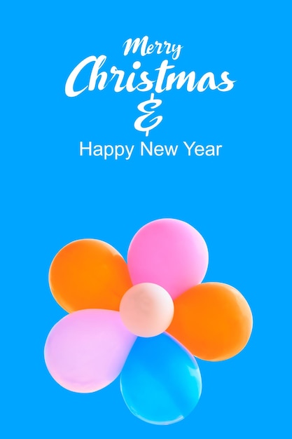 Merry Christmas and Happy New Year text on color background with balloon