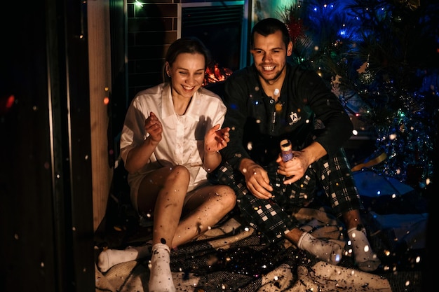 Merry christmas and happy new year young couple in love celebrating christmas or new year eve at