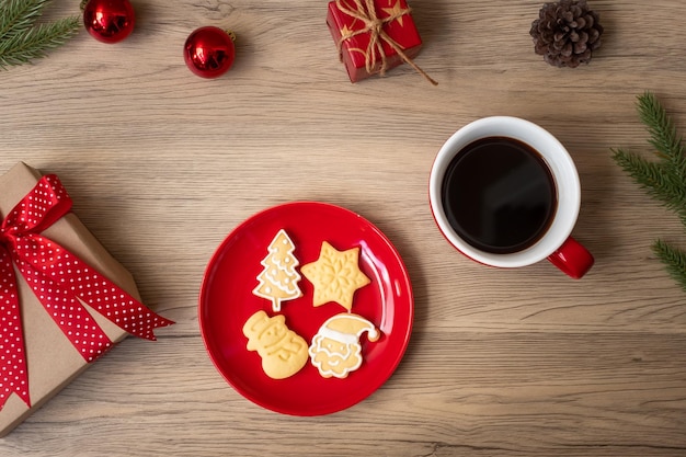 Merry Christmas with homemade cookies and coffee cup on wood table background Xmas eve party holiday and happy New Year concept