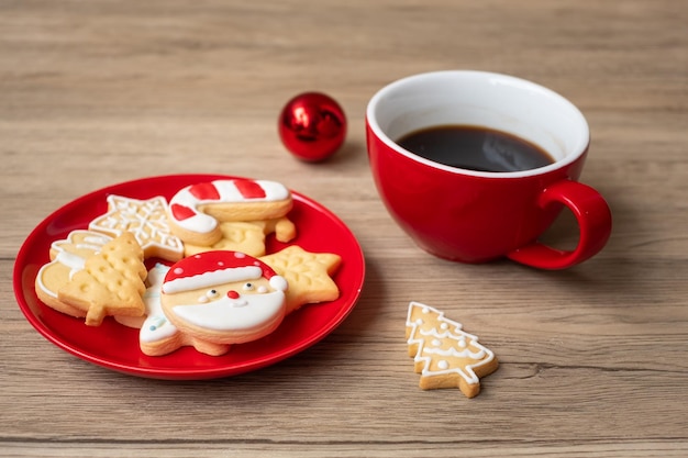 Merry Christmas with homemade cookies and coffee cup on wood table background Xmas eve party holiday and happy New Year concept