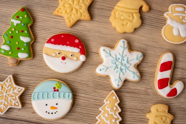 Merry Christmas with homemade cookies on wood table background. Xmas, party, holiday and happy New Year concept