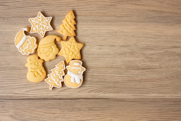 Merry Christmas with homemade cookies on wood table background. Xmas, party, holiday and happy New Year concept