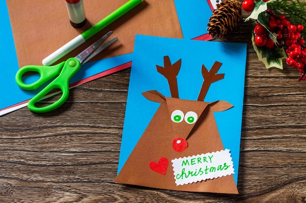 Merry greeting card with a Christmas deer Handmade Childrens creativity project crafts for kids