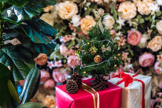 Merry x-mas,Close up of Colorful balls ,gifts box and Christmas greeting picture parcel decoration on Green Christmas tree background Decoration During Christmas and New Year.