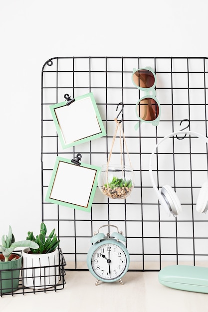 Photo mesh board with cards, eyeglasses, house plants stay home, home organisation, decoration, planning, slow living concept