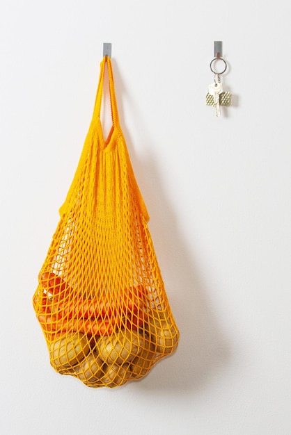 Mesh grocery bag Reusable bag Vegetarianism raw food diet conscious consumption grid orange mesh bag keys on the wall hanging on a hook Potato bag Raw potatoes