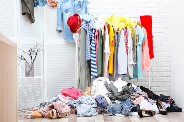 Messy dressing room interior with clothes rack