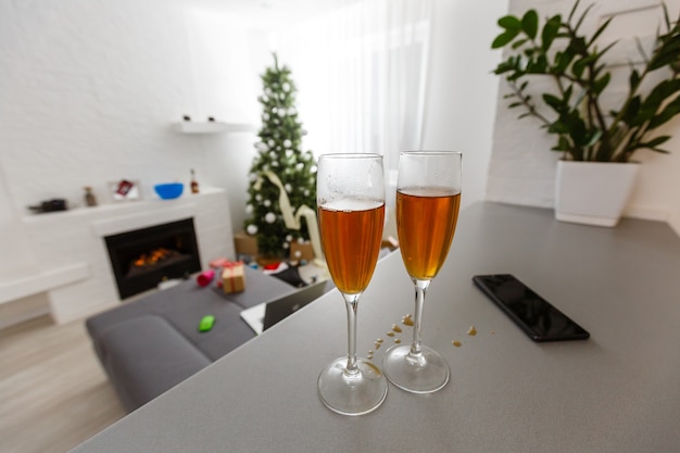 Messy living room interior with Christmas tree. Chaos after party