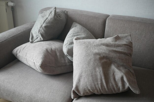 Messy modern grey sofa top view