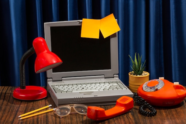 Messy office desk with old computer still life