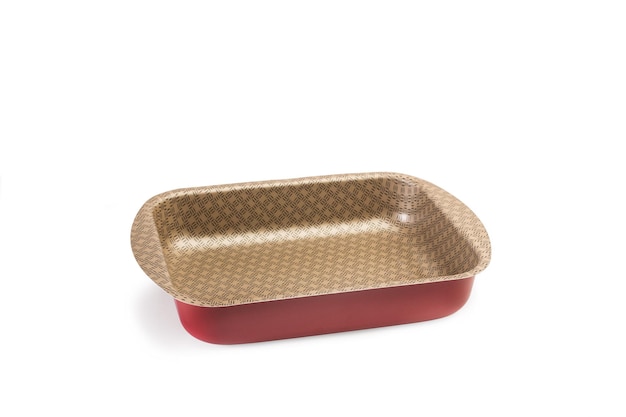 A metal baking dish on a white background with copy space