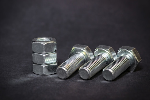 Metal bolts and nuts are used in construction