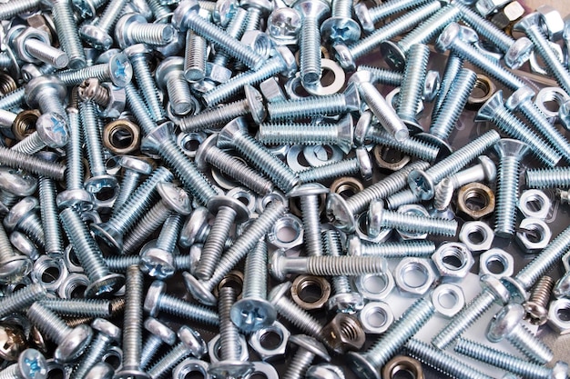 Metal bolts and nuts closeup background or texture