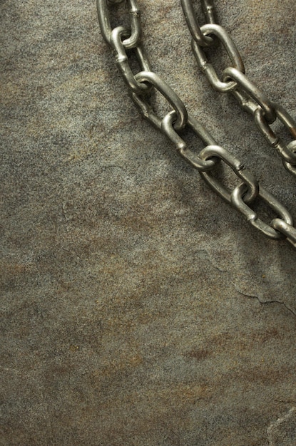 Metal chain at stone background