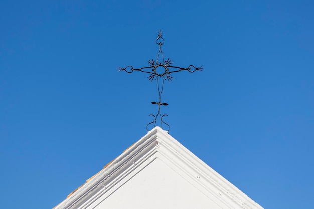 Metal christian cross typically placed on top of churches