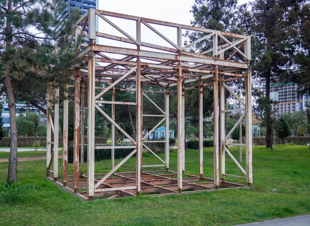 Metal construction Metal frame trade tent Abandoned structure in the park rusty scrap metal