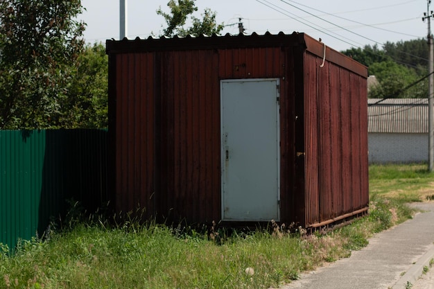 Metal container with a door in the village