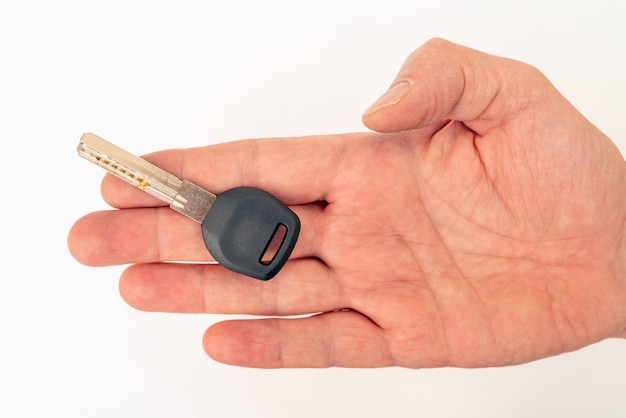 Metal door key in a man's hand