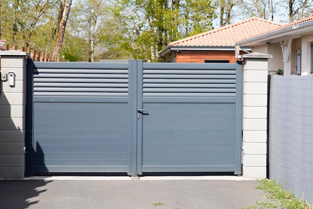 Metal gate grey home fence portal on suburb street house