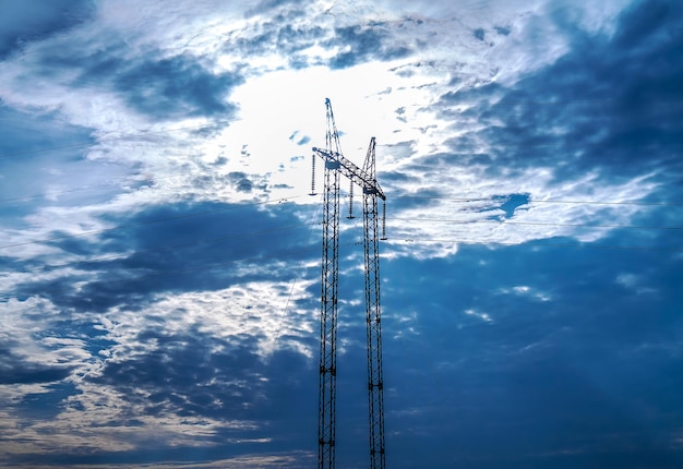 Metal highvoltage support against the backdrop of a stormy sky