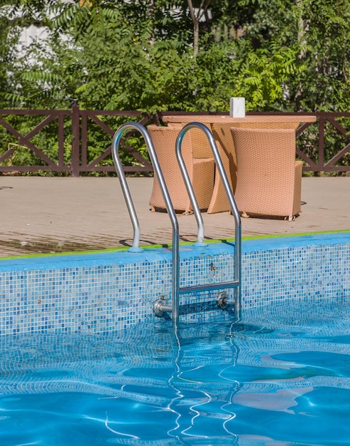 Metal ladder in a pool of water