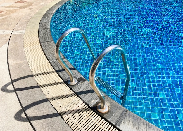 Metal ladder at swimming pool