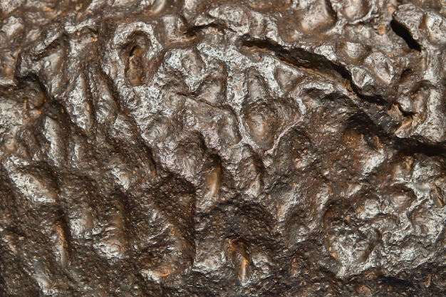 The metal meteorite surface closeup as background