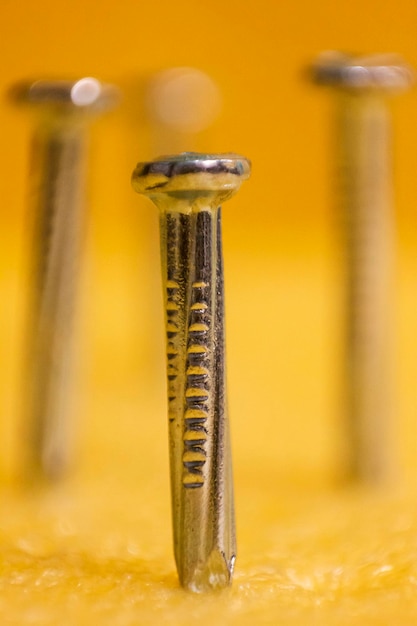 Metal Nail Photography and Nail with Yellow Background