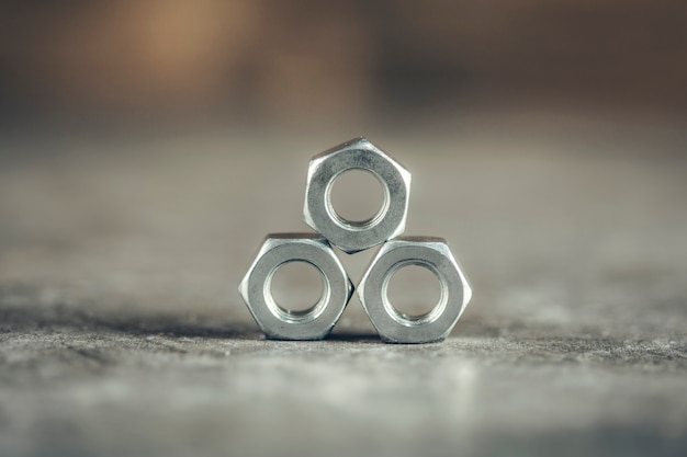 Metal nuts on the gray table